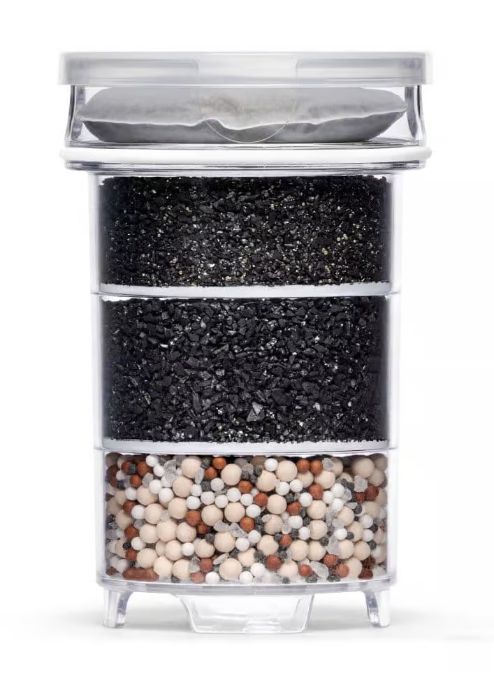 A white, cylindrical Lotus Vita ENYA replacement filter cartridge, designed to purify and mineralize water.